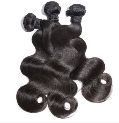 Three bundles of Brazilian body wavy hair extensions