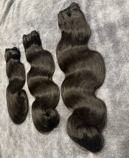 Three bundles of Human hair in body wavy upright angle