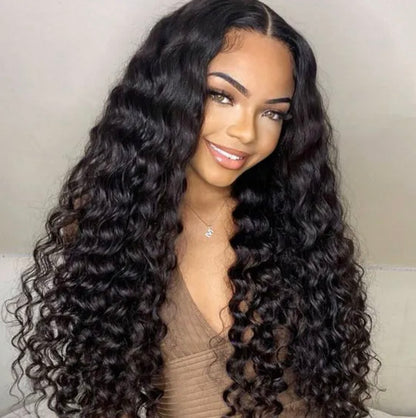 Smiling beautiful afro Caribbean woman wearing Brazilian natural human hair deep loose wave 