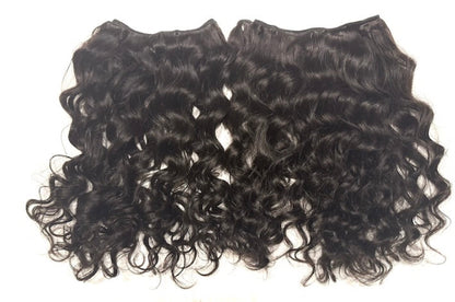Two pieces of Brazilian loose  curly hair extensions on a white background