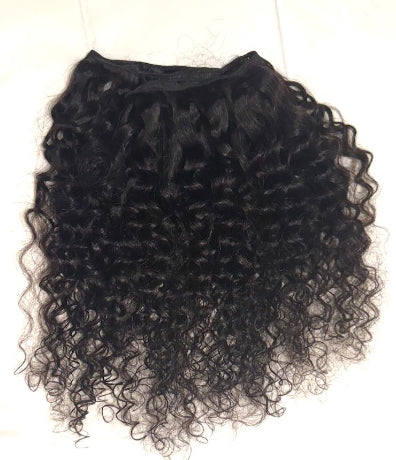 Black curly hair extension on a white background